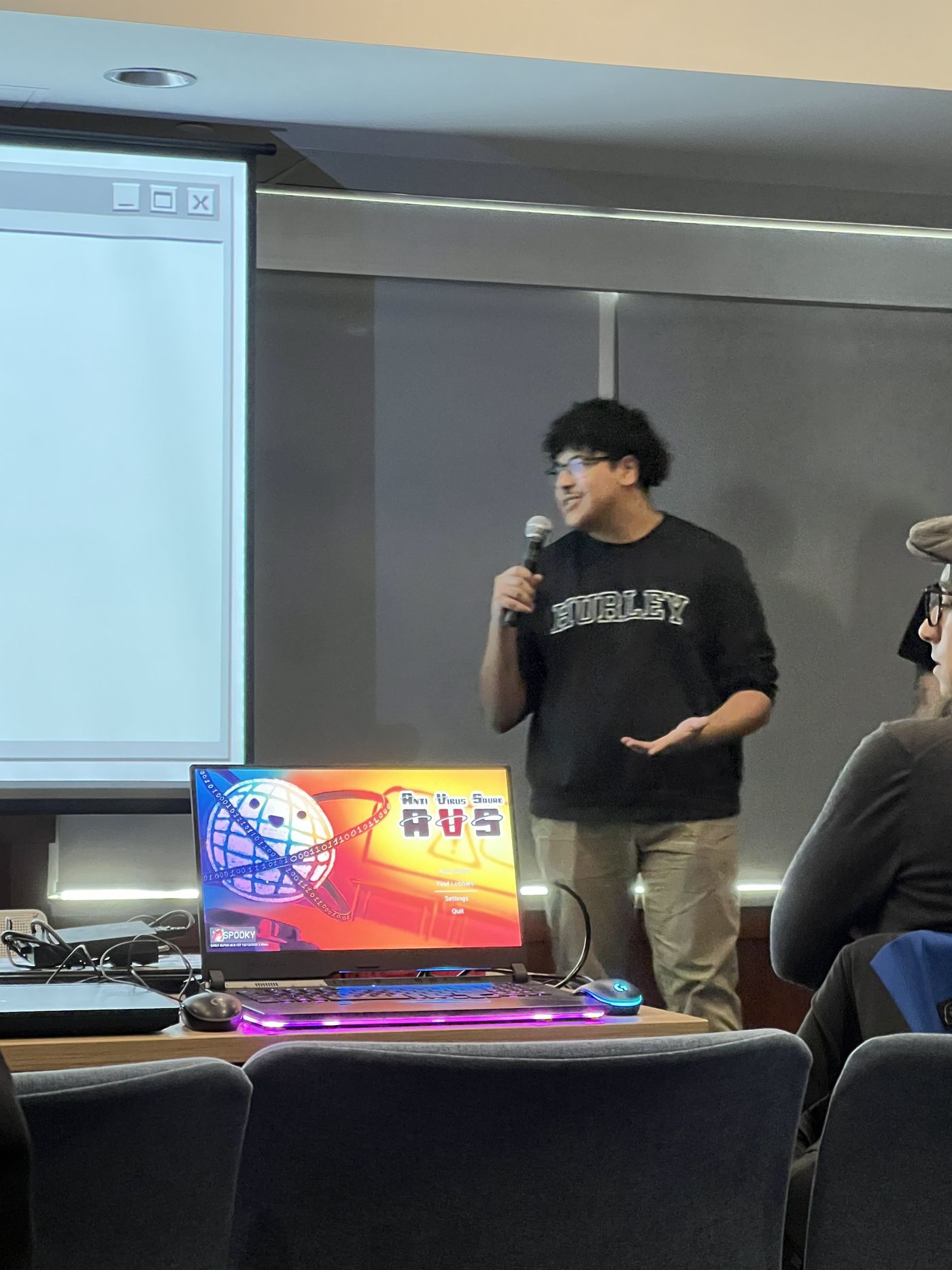 Marwan presenting with a professional speaker pose.